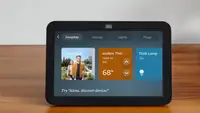 A black Amazon Echo Show 8 sits on a table.