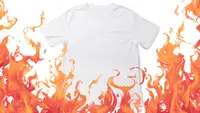 A white t-shirt on a white background has flames leaping over it