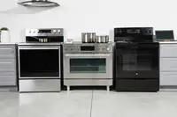 Three ranges in a room lined up next to each other