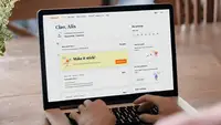 A laptop sits on a table showing Babbel's dashboard