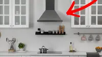 A red arrow points to a range hood above a stove