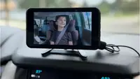 Babyvue Wireless Baby Car Monitor mounted on a dashboard.