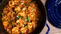 A pot full of homemade jambalaya with the lid removed, shot from above.