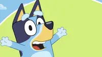 Bluey on a green background