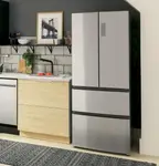 A close-up of our top-rated refrigerator, the Haier HRF15N3AGS, installed in a modern kitchen.