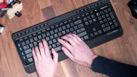 Hands typing on a keyboard