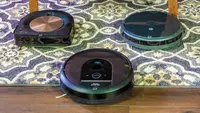 The iRobot Roomba i7+, S9+, and 694 on carpet.