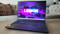 A laptop sits open on a coffee table