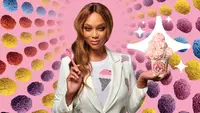 Supermodel Tyra Banks poses with scoops of pink ice cream surrounded by sprinkle-covered treats.