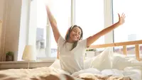 Woman stretching in the morning light