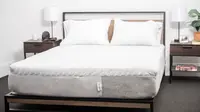 White mattress with pillows but without sheets.