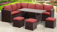 A 7-piece outdoor dining set placed on the back patio of someone's home.