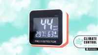 An air quality monitor floats in a blue sky.