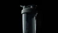 Close-up of a black BlenderBottle shaker bottle.