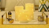 A set of candles with string lights in a living room.