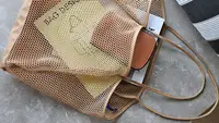 A beach bag being used to store items for a beach trip.