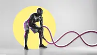 man using battle rope