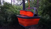 A camping sink being used at a campsite.