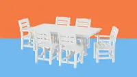 A white Polywood outdoor dining set against an orange and blue background.