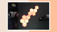Govee Hexagon Lights mounted on wall in living room next to book case.
