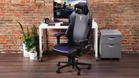 The SecretLab gaming chair in our labs in front of a desktop.