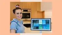 Molly Burke posing next to an Echo Show 15.