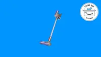 The Dyson V8 Absolute cordless vacuum on a blue background.