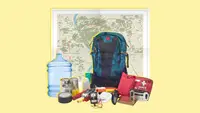Emergency preparedness items like a backpack, a first aid kit, a radio with antenna, a jug of fresh water, masks, tins cans of food, a geographic map and a flashlight.