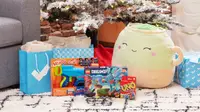 Gift products next to a Reviewed gift bag, stuffed animal, Uno cards, Lego's, and a Christmas tree.
