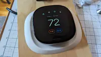 The Ecobee Smart Thermostat Premium is shown mounted on a board for testing.