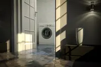 A washing machine sits in basement flooding.