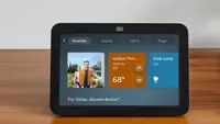 A black Amazon Echo Show 8 sits on a table.