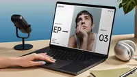 A person uses a laptop displaying a podcast website, an ideal idea for creating personalized holiday gifts like custom digital projects.