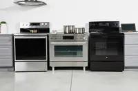 Three ranges in a room lined up next to each other
