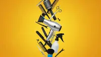 Hair styling tools and accessories against a yellow background
