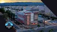 Reviewed's Readers' Choice Award winner badge on top of an image of a large storage building in a city