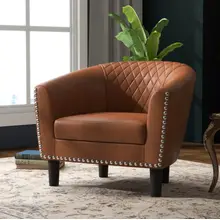 Product image of Trent Austin Design Alverstone 28.4-Inch Wide Nailhead Trim Faux Leather Barrel Chair and a Ottoman