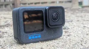 The GoPro Hero12 Black laying on the ground in an outdoor setting.