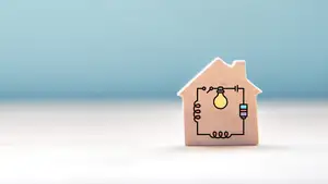 A small wooden toy house block with an electrical circuit graphic overlay