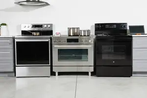 Three ranges in a room lined up next to each other