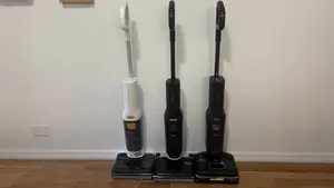 Roborock F25 Series Wet-Dry Vacuums stand against a wall in a residential hallway