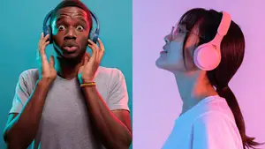 Two people listen to music through over-the-ear headphones