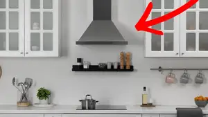 A red arrow points to a range hood above a stove