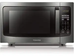 A pair of stainless-steel microwaves sit side by side on a wood-grain countertop.