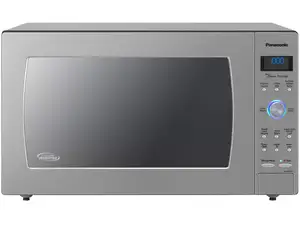 A pair of stainless-steel microwaves sit side by side on a wood-grain countertop.