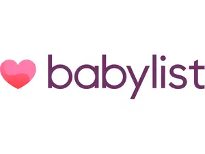 A woman enjoys a baby registry gift with her friends.