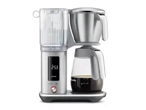 Two coffee pots sit on a beige background surrounded by coffee beans