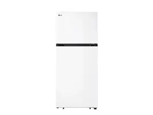 Three different refrigerators standing against a brick wall