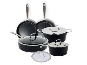 Alva Ceramic Cookware Set sitting on top of spider-burner stovetop with a pan cooking chicken.