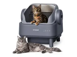 A cat lays beside the OneIsAll litter box